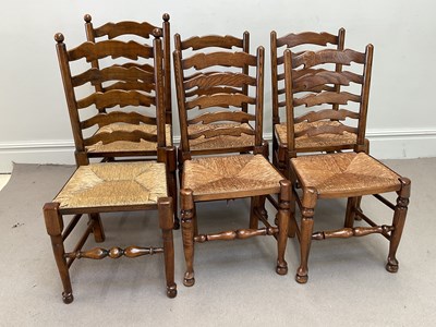 Lot 1188 - A near set of six oak ladderback country...