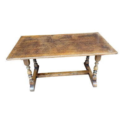 Lot 92 - A reproduction oak coffee table on turned...