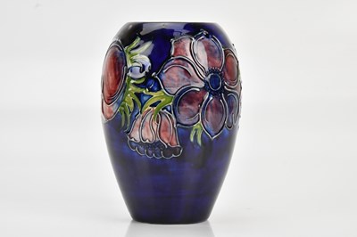 Lot 1496 - MOORCROFT; an ovoid form vase, decorated in...