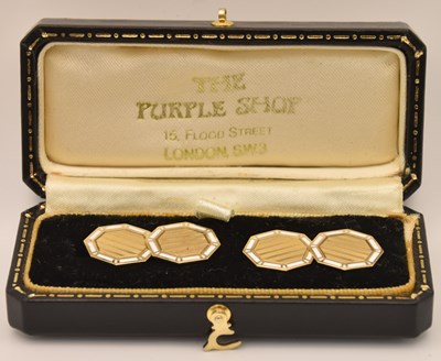 Lot 1379 - A pair of 10K yellow gold white enamelled...