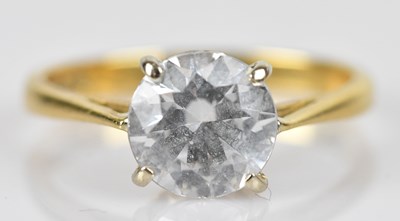 Lot 596 - An 18ct yellow gold solitaire ring set with a...