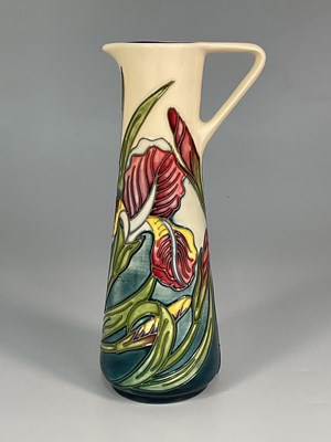 Lot 232 - MOORCROFT; an 'Iris' pattern jug, designed by...