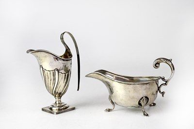 Lot 871 - A George VI hallmarked silver sauce boat,...