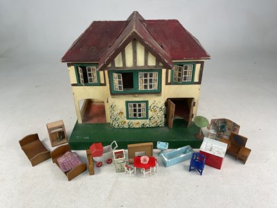 Lot 71 - TRI-ANG; a 1960s doll's house of wood and...