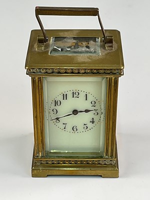 Lot 340 - A miniature French brass cased eight day...