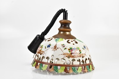 Lot 579 - A ceramic ceiling light fitting with hand...