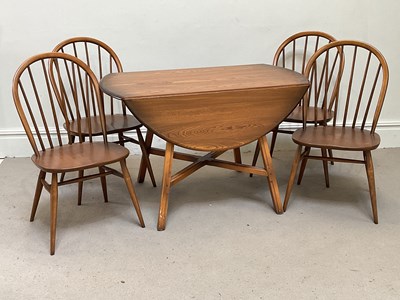 Lot 9 - ERCOL; a medium elm drop-leaf table, height...
