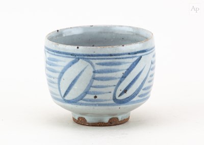 Lot 631 - A small stoneware cup covered in pale grey...