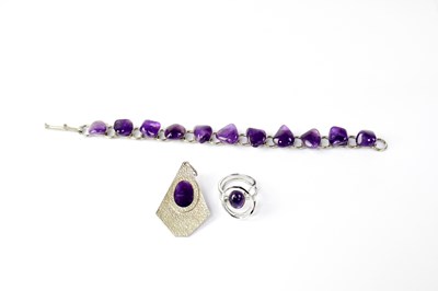 Lot 1059 - A stainless steel chain link bracelet mounted...