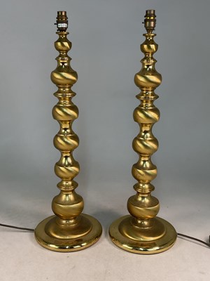 Lot 622 - A pair of mid 20th century brass table lamps,...