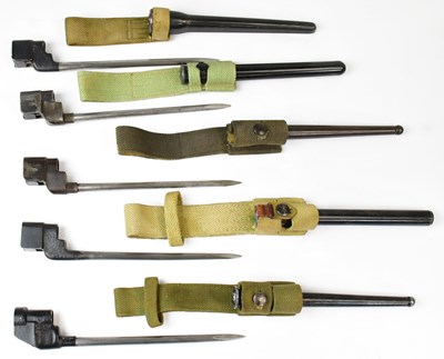 Lot 602 - Five spike bayonets with canvas frogs,...