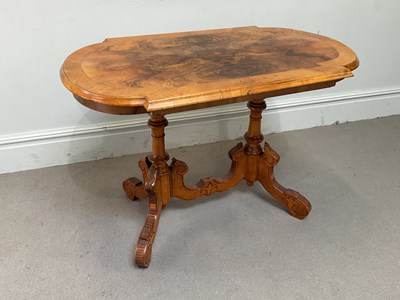 Lot 1234 - A Victorian figured walnut centre table, with...