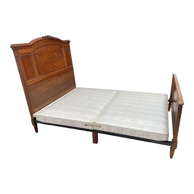 Lot 1232 - A French carved walnut double bed, with...