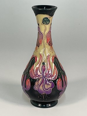 Lot 206 - MOORCROFT; a 'Fuchsia' pattern vase, designed...