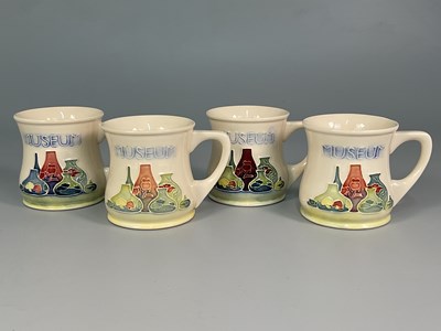 Lot 307 - MOORCROFT; four Moorcroft Museum 1989 mugs,...