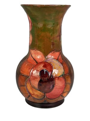 Lot 217 - MOORCROFT; a 'Flambe Rose' pattern vase,...