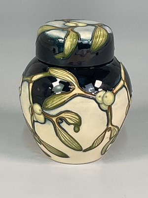 Lot 213 - MOORCROFT; a 'Mistletoe' pattern ginger jar...