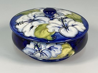 Lot 233 - MOORCROFT; a'Blue Hibiscus' pattern lidded...