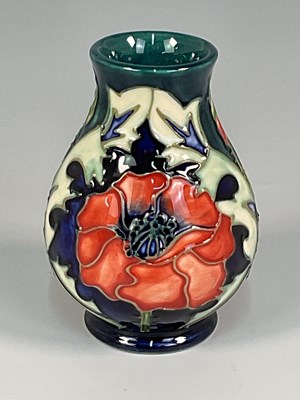 Lot 231 - MOORCROFT; a 'Poppy' pattern vase, designed by...