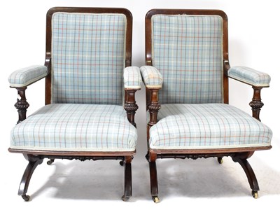 Lot 28 - A pair of Victorian Gothic mahogany salon arm...
