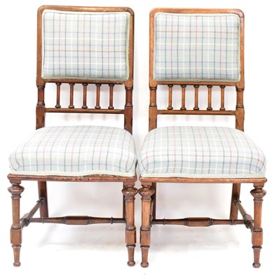 Lot 28 - A pair of Victorian Gothic mahogany salon arm...
