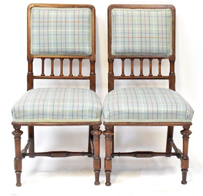 Lot 28 - A pair of Victorian Gothic mahogany salon arm...