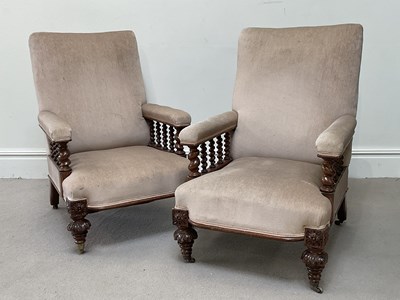 Lot 50 - A pair of Victorian carved oak library elbow...