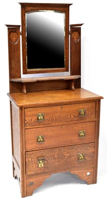 Lot 53 - An Edwardian Arts and Crafts oak dressing...