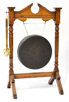 Lot 77 - A late Victorian golden oak dinner gong, with...