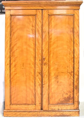 Lot 68 - A Victorian satin birch wardrobe, with two...