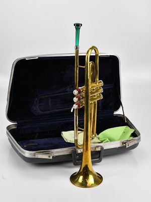 Lot 2189 - CONN; a brass trumpet, cased.
