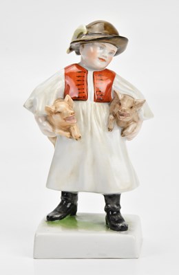 Lot 1437 - HEREND; a boy holding pigs, height 18cm.