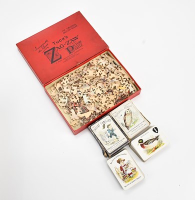 Lot 2148 - A vintage jigsaw and two sets of playing cards...