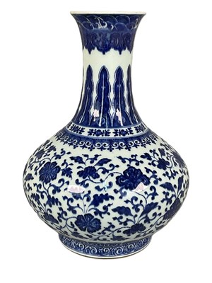 Lot 107 - A Chinese blue and white lotus vase decorated...