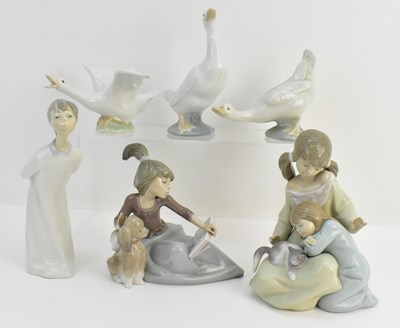 Lot 155 - LLADRÓ; four high glazed figures comprising...
