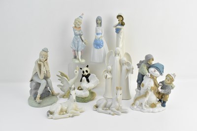 Lot 152 - Nine high glazed Continental porcelain figures...