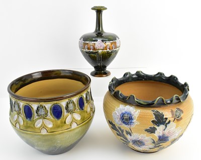 Lot 212 - ROYAL DOULTON; three Lambeth pottery items...