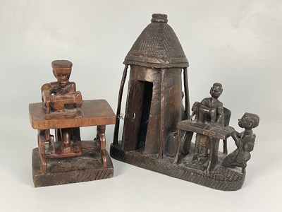 Lot 2 - An African hand carved hardwood sculpture...