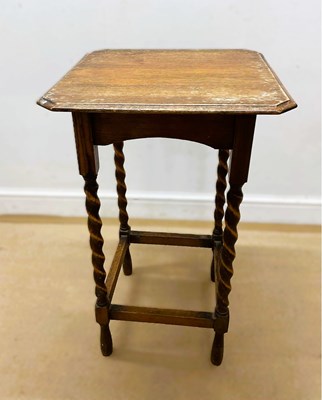Lot 750 - An oak occasional table on barley twist legs...