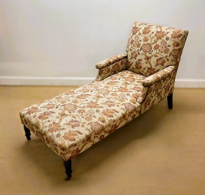 Lot 711 - A daybed, with floral pattern fabric...