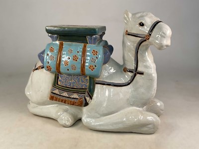 Lot 762 - A ceramic garden stool in the form of a camel...