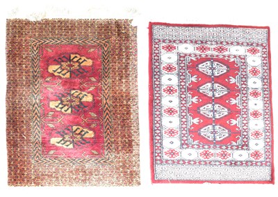 Lot 109 - A Caucasian tribal woollen rug, sewn onto a...