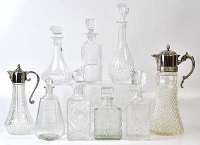 Lot 313 - Seven cut glass and press-moulded decanters,...