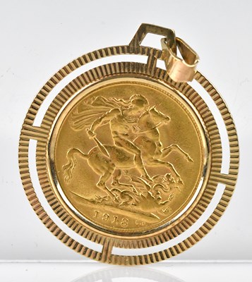 Lot 228 - A George V full sovereign, 1918, in 9ct yellow...