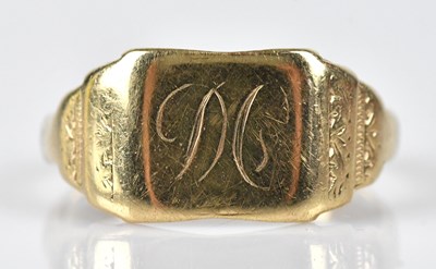 Lot 522 - A yellow metal signet ring with engraved...