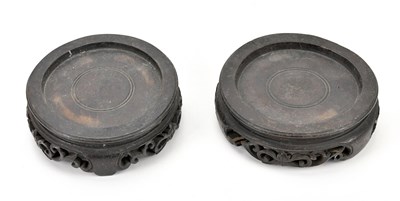 Lot 662 - A pair of hardwood Oriental vase pedestals,...