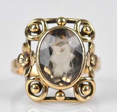 Lot 422 - A yellow metal plaque ring set with an oval...