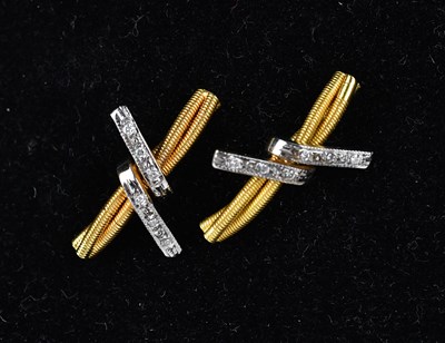 Lot 164 - A pair of 18ct yellow and white gold textured...