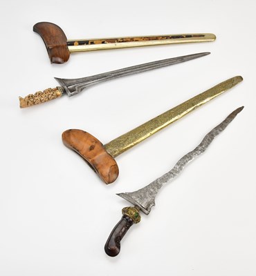 Lot 1063 - Two late 19th/early 20th century kris swords,...