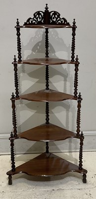 Lot 183 - A Victorian walnut five-tier whatnot, with...